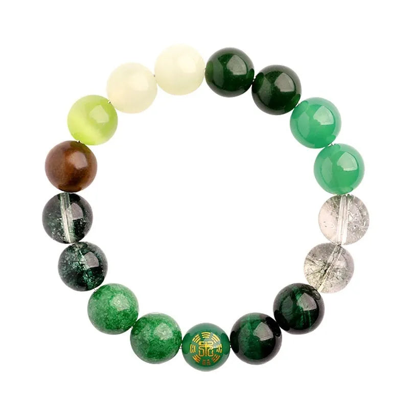 Green agate energy balance bracelet with metal lucky cat and auspicious charm on a wooden surface.