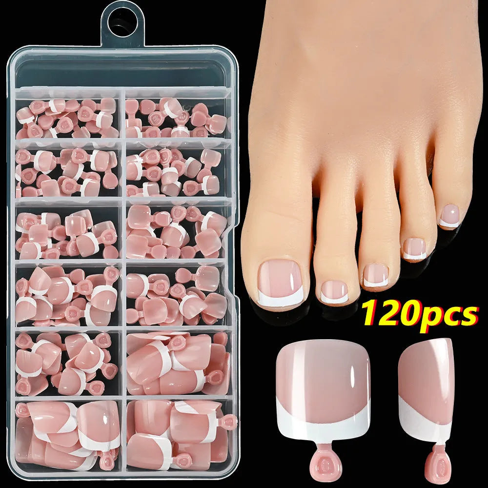 120 piece boxed set of full square short artificial toenails with French white edge design on nude base
