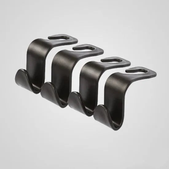 Set of four black PP plastic universal car seat back hooks on a car front seat backrest