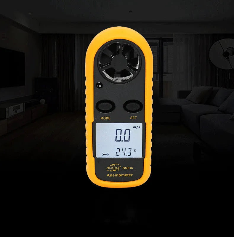 Orange digital handheld anemometer for measuring wind speed with digital display.