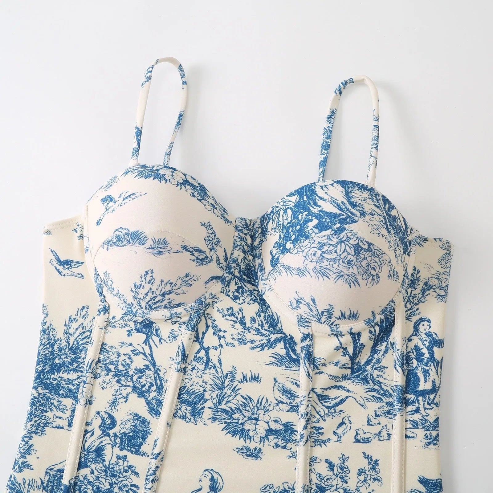 Blue patterned women's one-piece swimsuit with matching gauze skirt shown in multiple size options