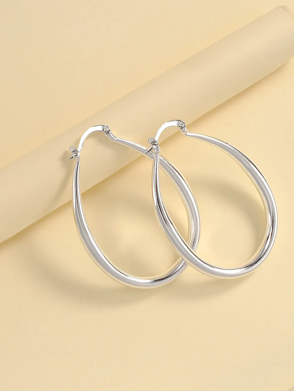 Geometric oval metal earrings for women with electroplated finish and alloy inlaid gems in gold and silver