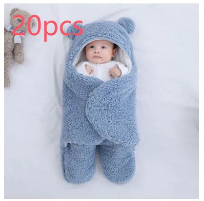 Cotton blend baby quilted sleeping bag wrapper in light blue, shown with size labels for 3M, 6M, and 9M.