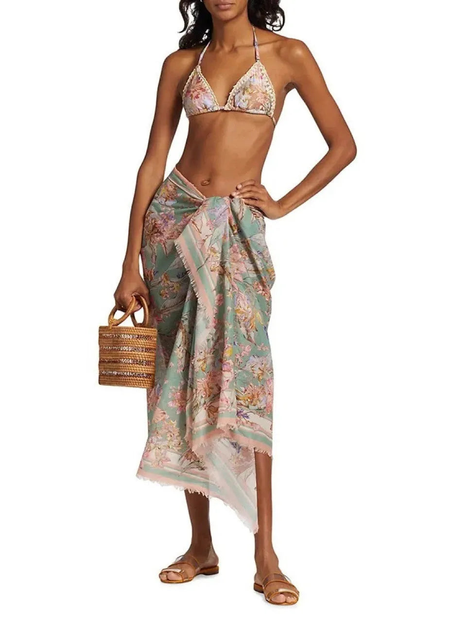 Women's creamy-white floral bikini set with matching skirt for beach holidays