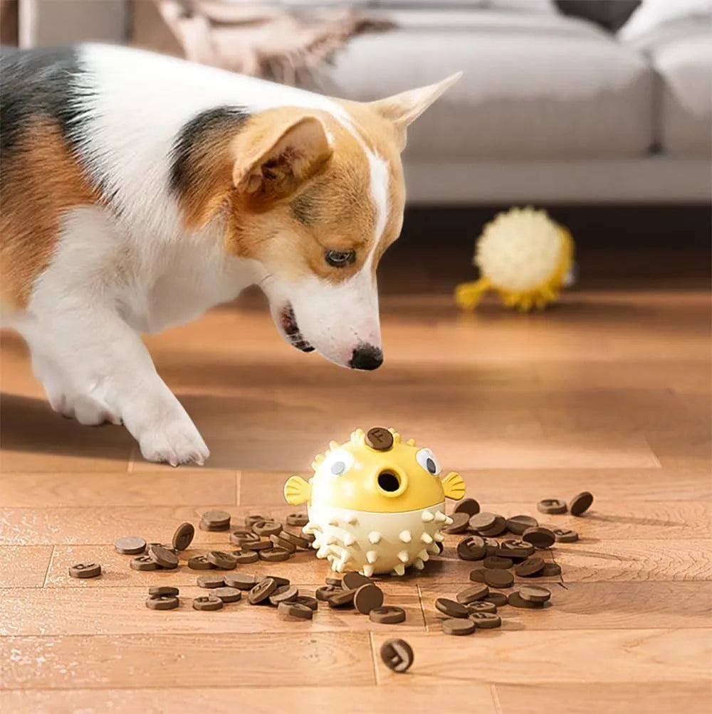 Green fish-shaped interactive dog toy with textured surface for treat dispensing and chewing.
