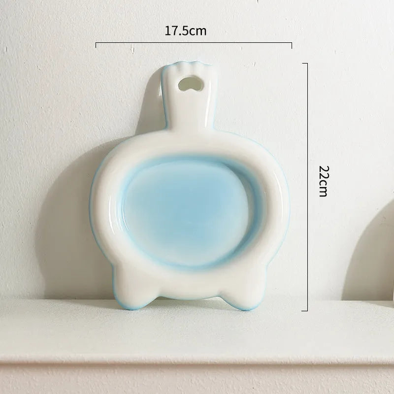 Blue ceramic cat bowl with shallow design for pet food and water
