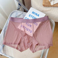 Man wearing thin grey seamless nylon boxer shorts with a mid-waist design.
