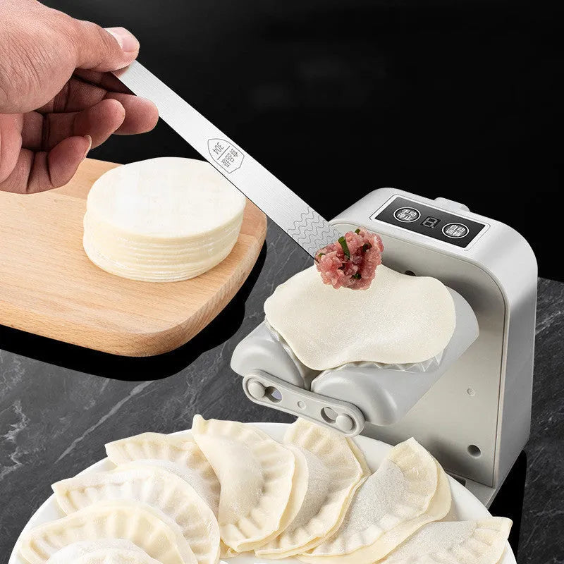 White electric dumpling maker machine with USB charging cable and accessories