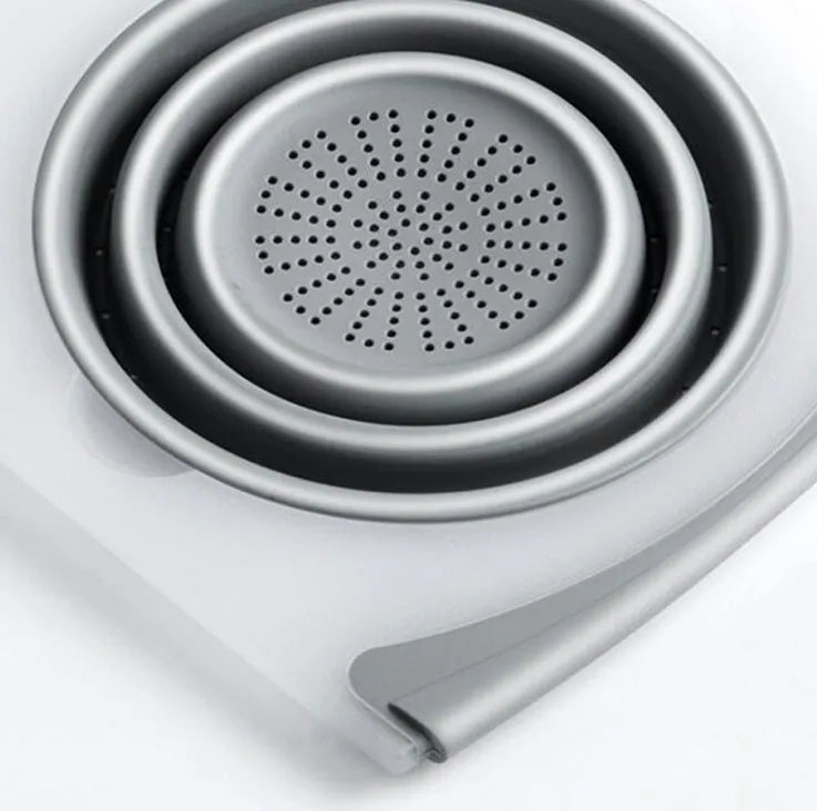 Grey folding chopping board with detachable drain basket showing 50cm cutting surface