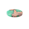 A solid wood resin coaster in a Nordic style, showing a round tumour green pattern on a 9.8cm wide, 1cm thick base.