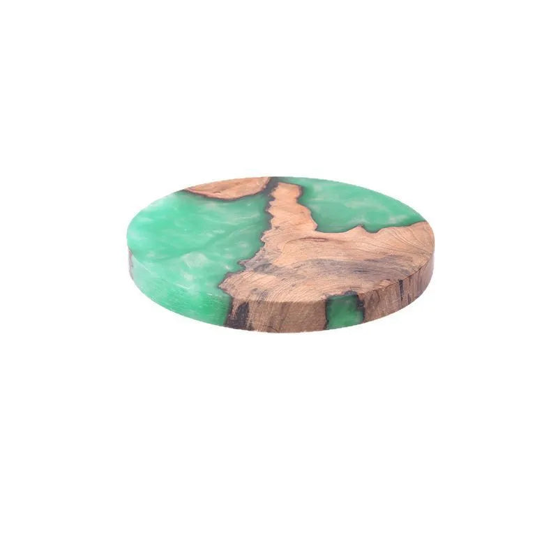 A solid wood resin coaster in a Nordic style, showing a round tumour green pattern on a 9.8cm wide, 1cm thick base.