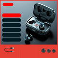 Black wireless Bluetooth in-ear earphones with a charging case on a table.