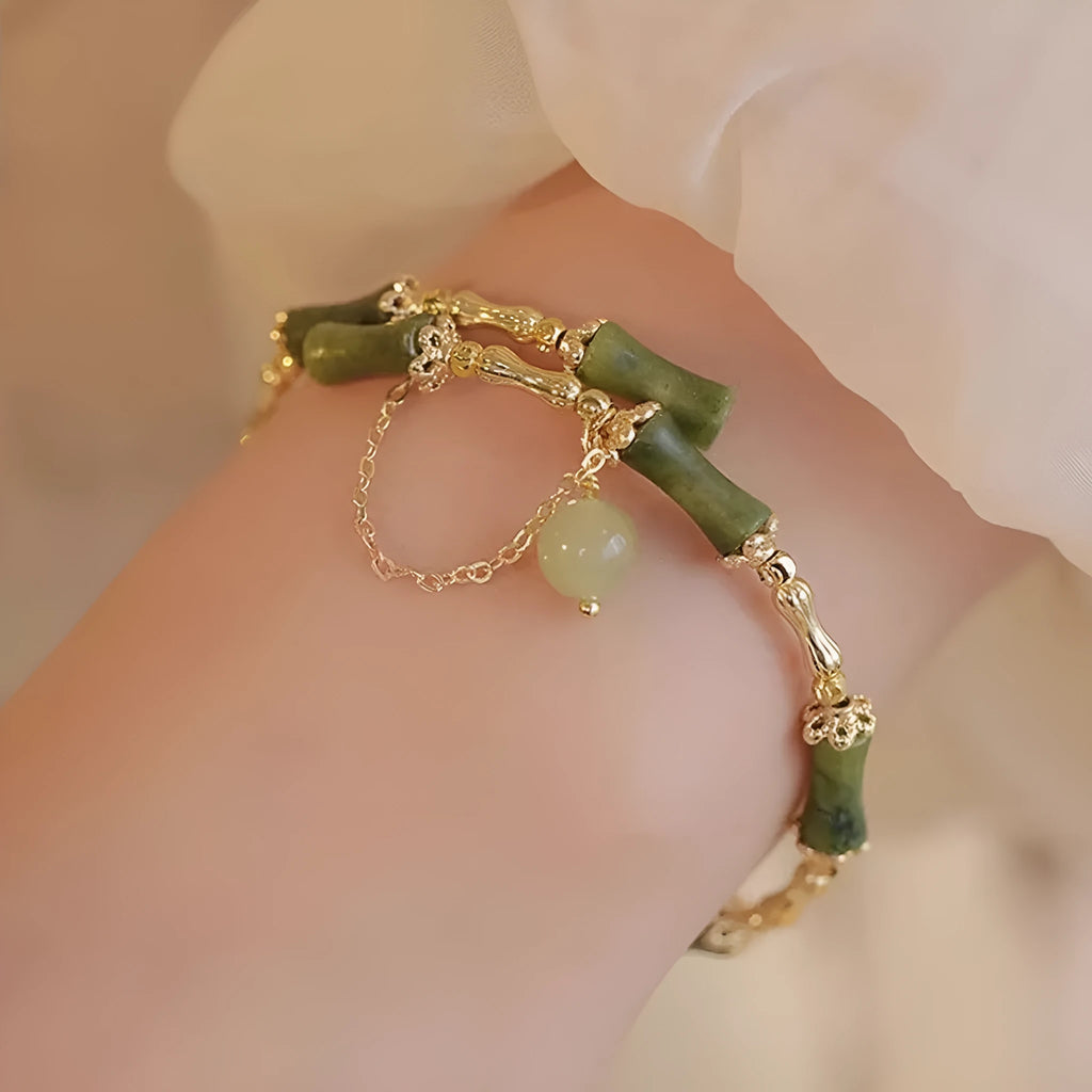 Women's bamboo bracelet with coloured glaze beads and a plum wine coloured bamboo joint centrepiece.