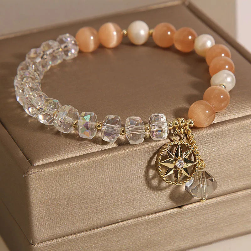 Orange Eight Awn Star bracelet with gold-plated setting and opal crystal inlay