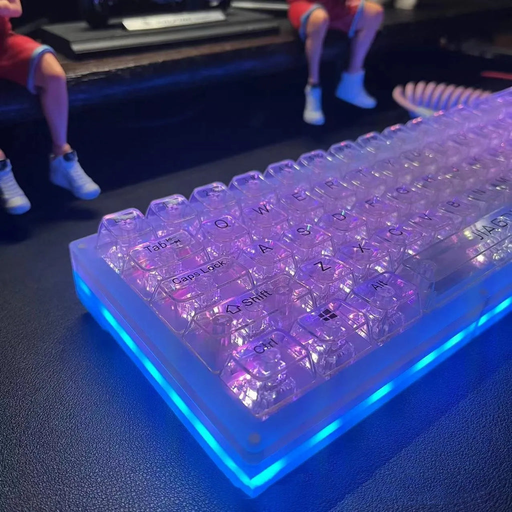Transparent plastic 132-key mechanical keyboard key cap set displayed on white background