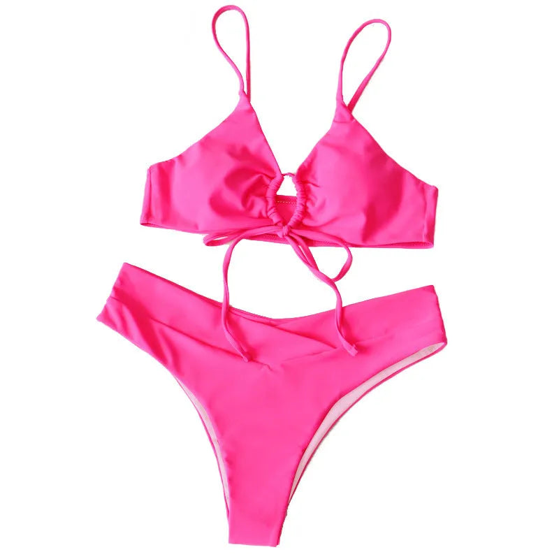 Women's orange tied bow bikini with split brief style on a mannequin.