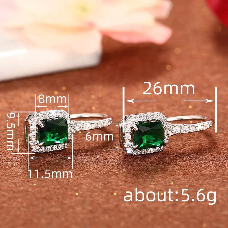 Pair of white gold colour copper earrings with inlaid zircon stones in geometric ring and quadrilateral design