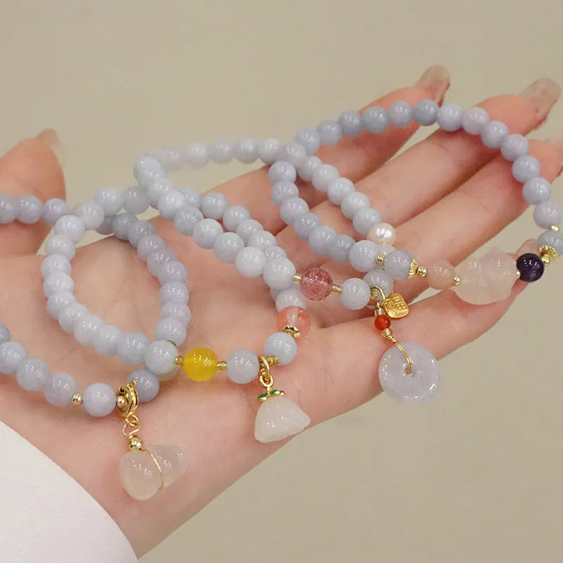 Women's gold-plated bracelet with artificial crystal and chalcedony pendant in climbing cat design