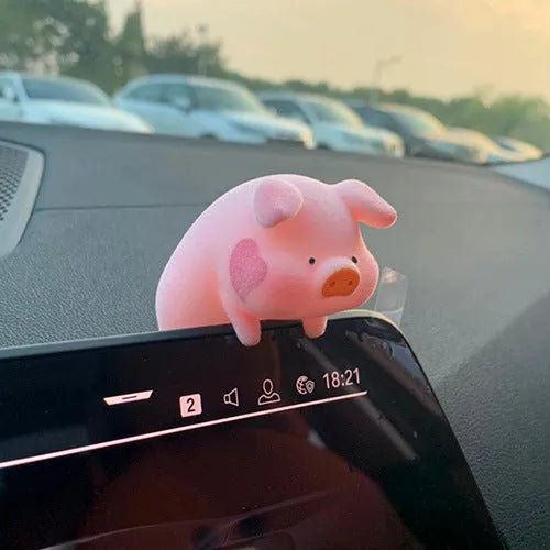 A hard resin cartoon pig car dashboard ornament in one of eight available decorative styles.