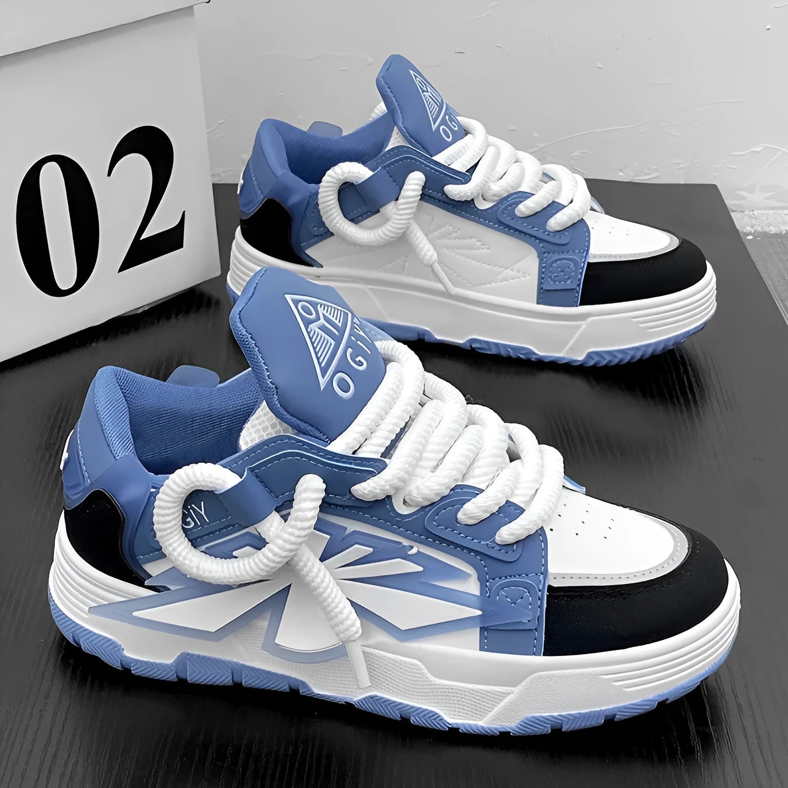 Men's white chunky sneakers with cartoon pattern, thick rubber sole, and front lace-up design on a plain background.