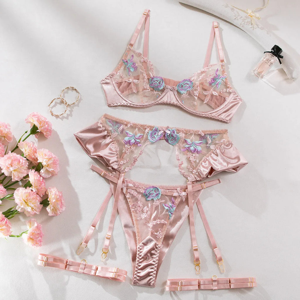 Light purple satin lingerie four-piece set with embroidery detail on a mannequin.