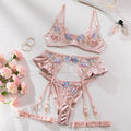 Light purple satin lingerie four-piece set with embroidery detail on a mannequin.