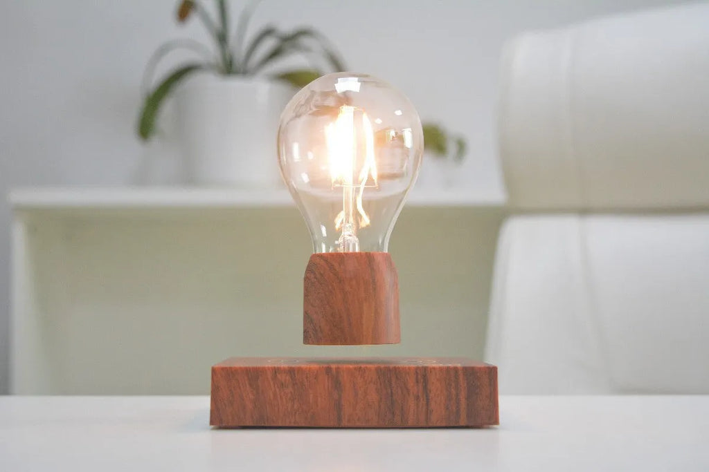 Magnetic levitation floating light bulb with imitation wood base.