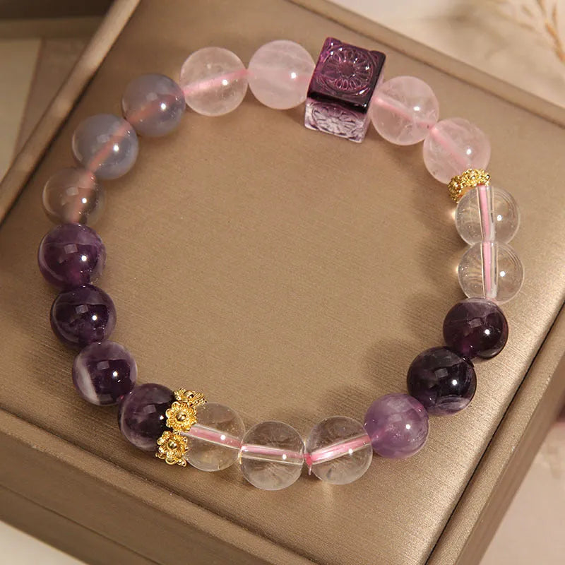 Purple women's bracelet with natural amethyst stones and rhinestones on a 10mm wide crystal band.