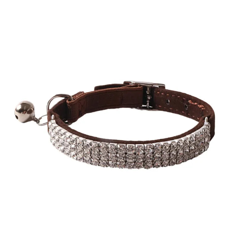 Elastic buckle cat collar in flocking fabric with gang drill detail, shown in multiple colours.