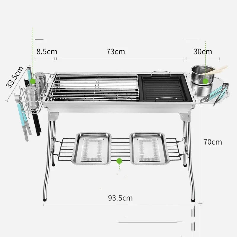 Stainless steel portable folding barbecue oven with large grill, shown unfolded outdoors.