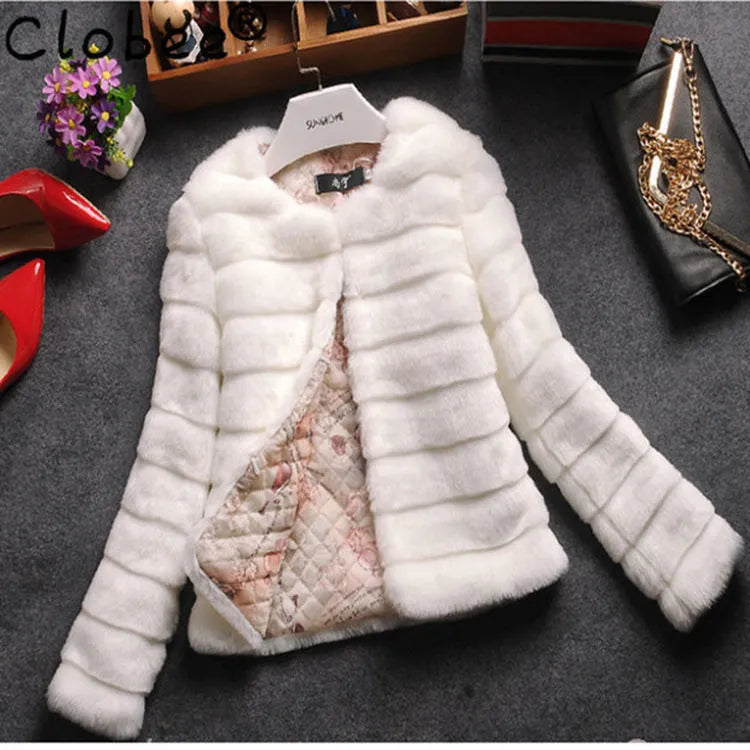 Women's short faux fur top in beige, black, or white with regular sleeves.