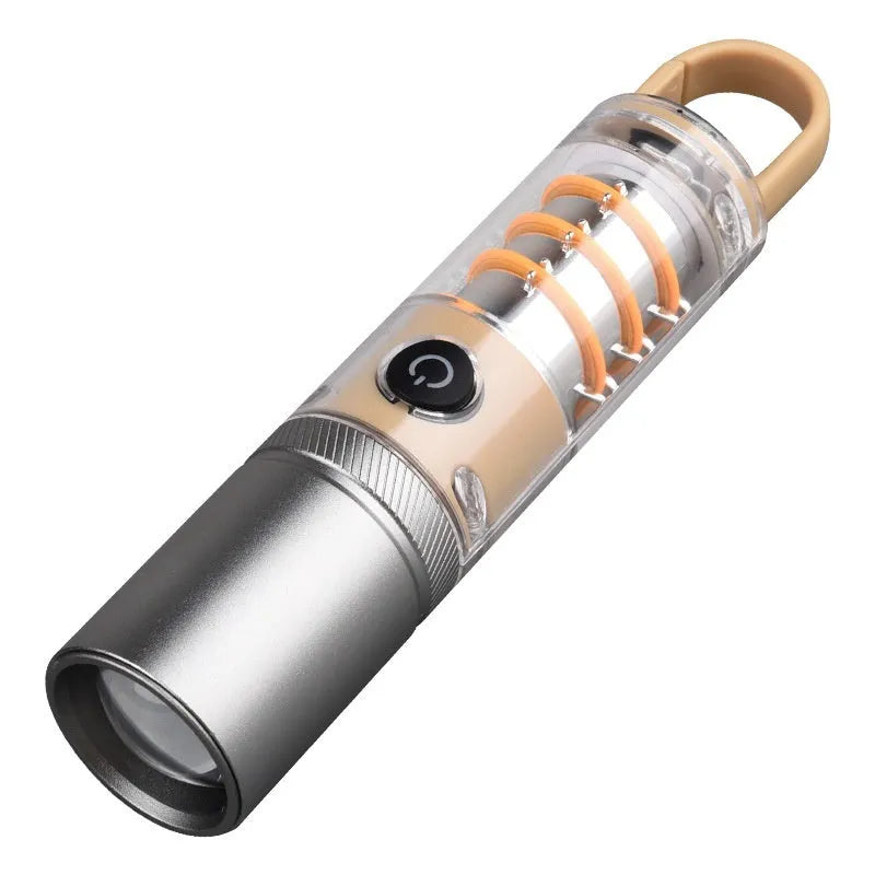 Orange 10W LED torch with optical zoom lens and keychain, shown with USB charging cable.