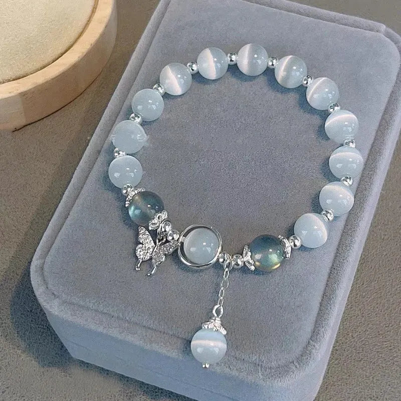 Close-up of electroplated opal cat's eye beaded bracelet for women with diamond-shaped charm