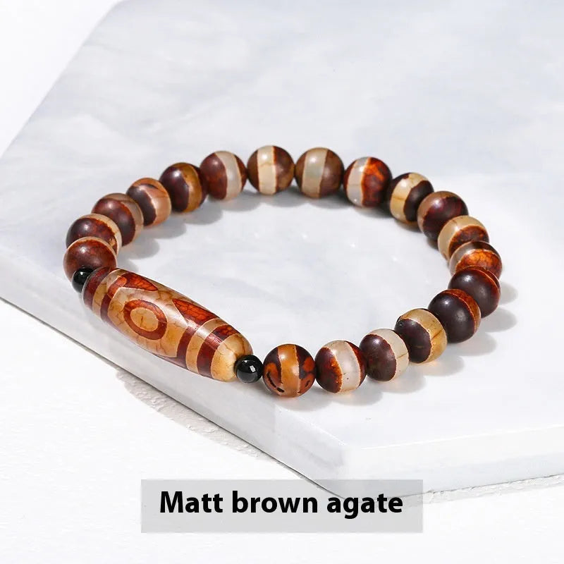 Handmade barrel shaped Dzi bead bracelet in green with geometry design