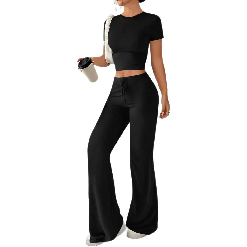 Black polyester two‑piece co‑ordination set with high‑waist trousers and a short‑sleeve t‑shirt.