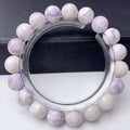 Close-up of a natural purple turquoise beaded bracelet with an adjustable string fastening.