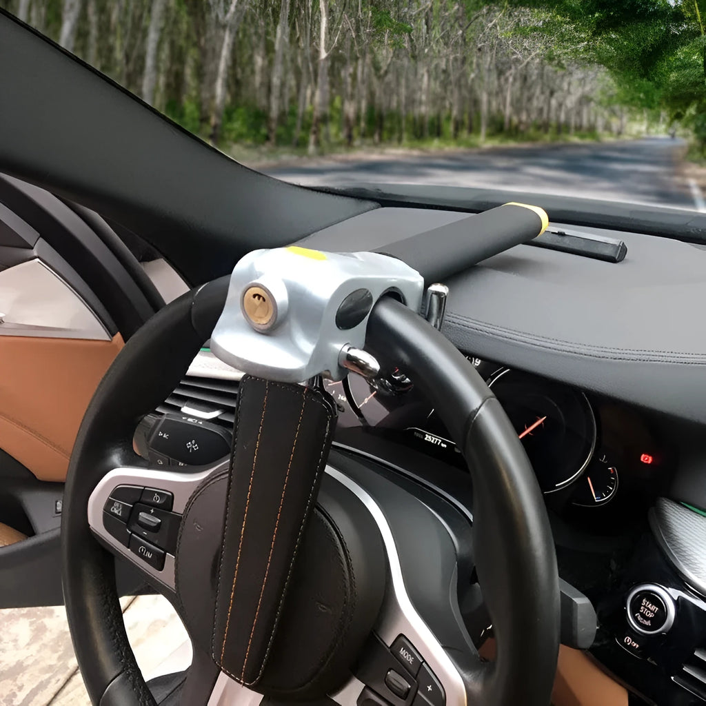 Universal car steering wheel lock in black gold, steel and aluminium alloy with copper core alarm, includes keys and wrench