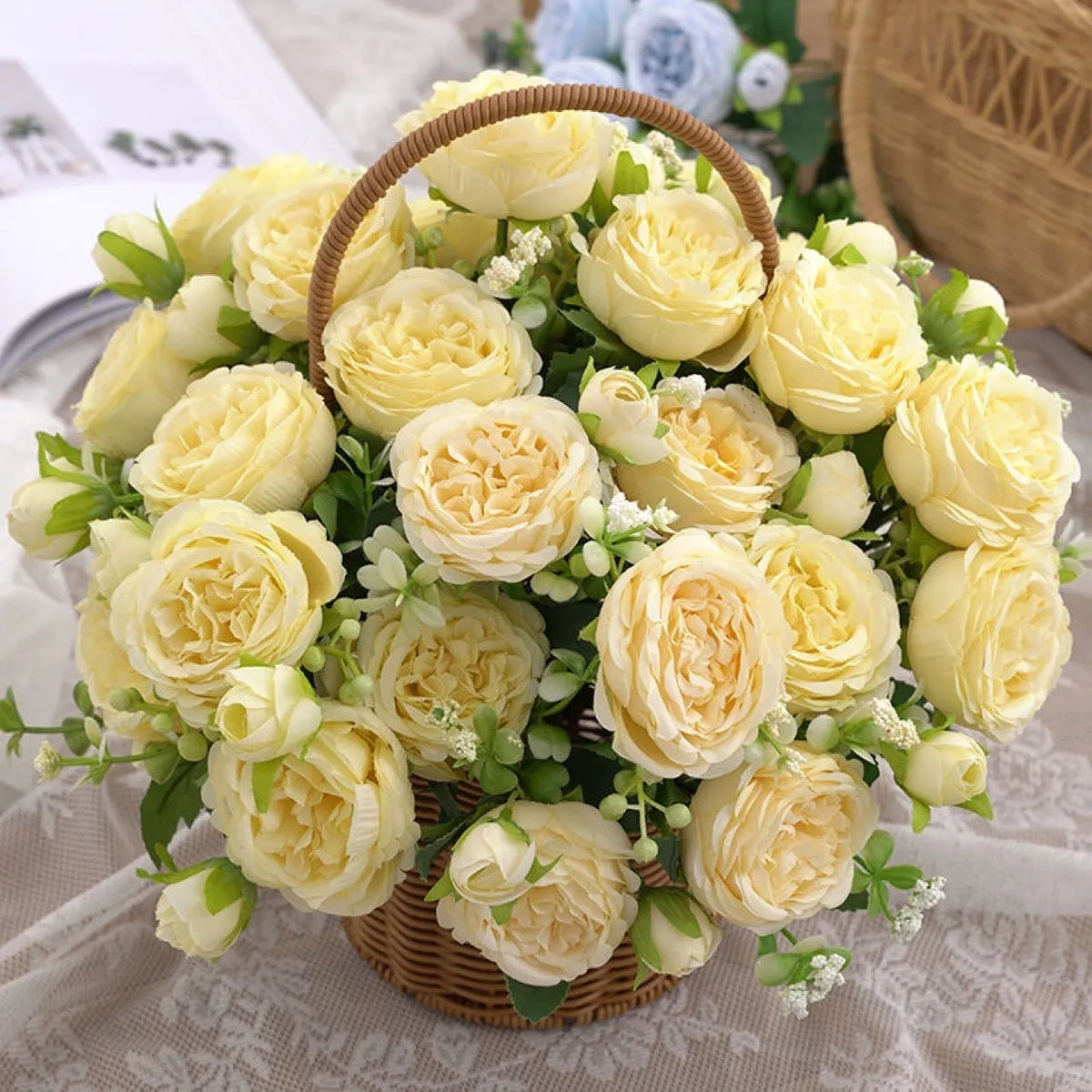 Artificial rose bouquet in pink beige champagne and light blue for wedding decoration, made from plastic and silk flower.