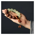 Rosewood flexible bracelet with fu character carving showing 20mm rings and amass fortunes colour finish