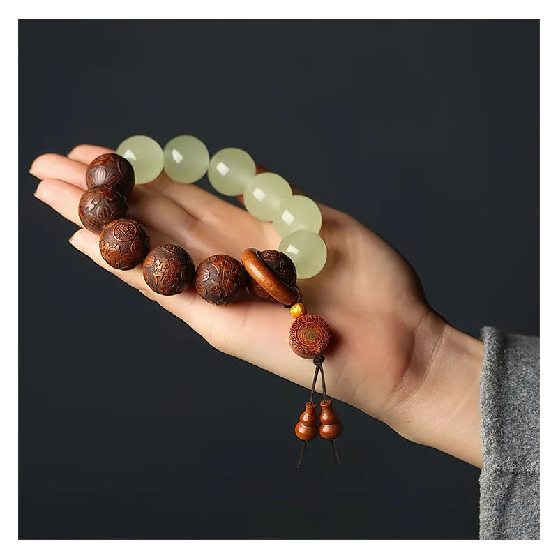 Rosewood flexible bracelet with fu character carving showing 20mm rings and amass fortunes colour finish