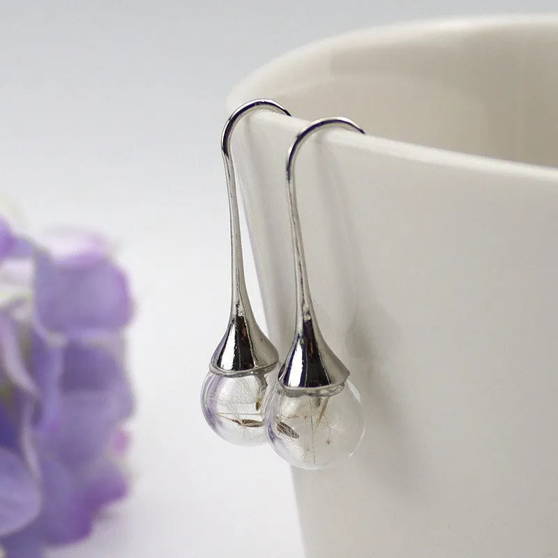 Transparent glass dandelion seed earrings on French hooks in 10mm and 16mm sizes