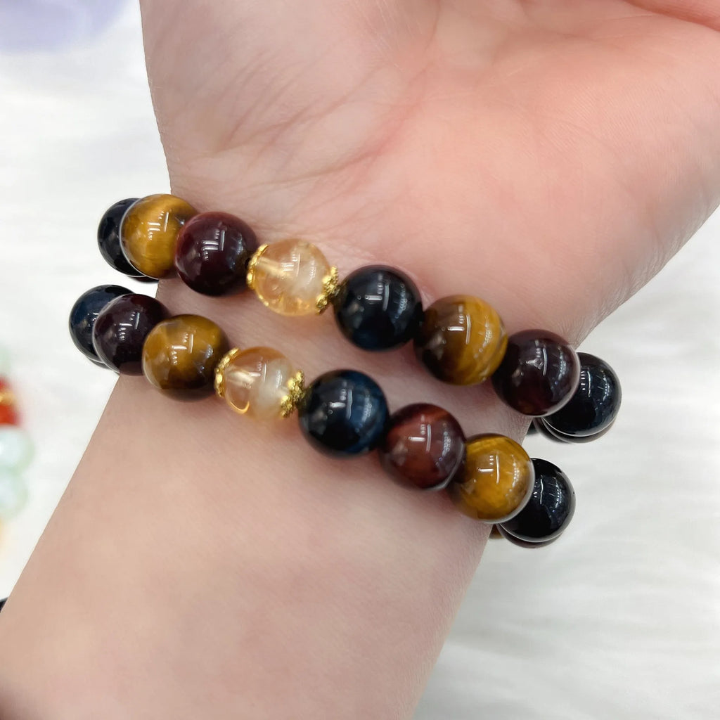 Natural Tiger Eye loose round bead bracelet on Maillard chain showing earthy banded stone patterns