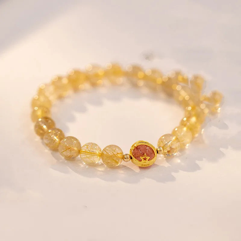 Natural citrine and gold rutilated quartz crystal bracelet with diamond-shaped beads