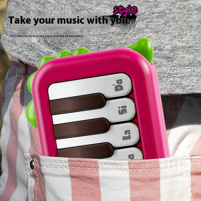 Baby pocket electronic keyboard toy in Little Piano Pattern design, shown in green and pink colour options.