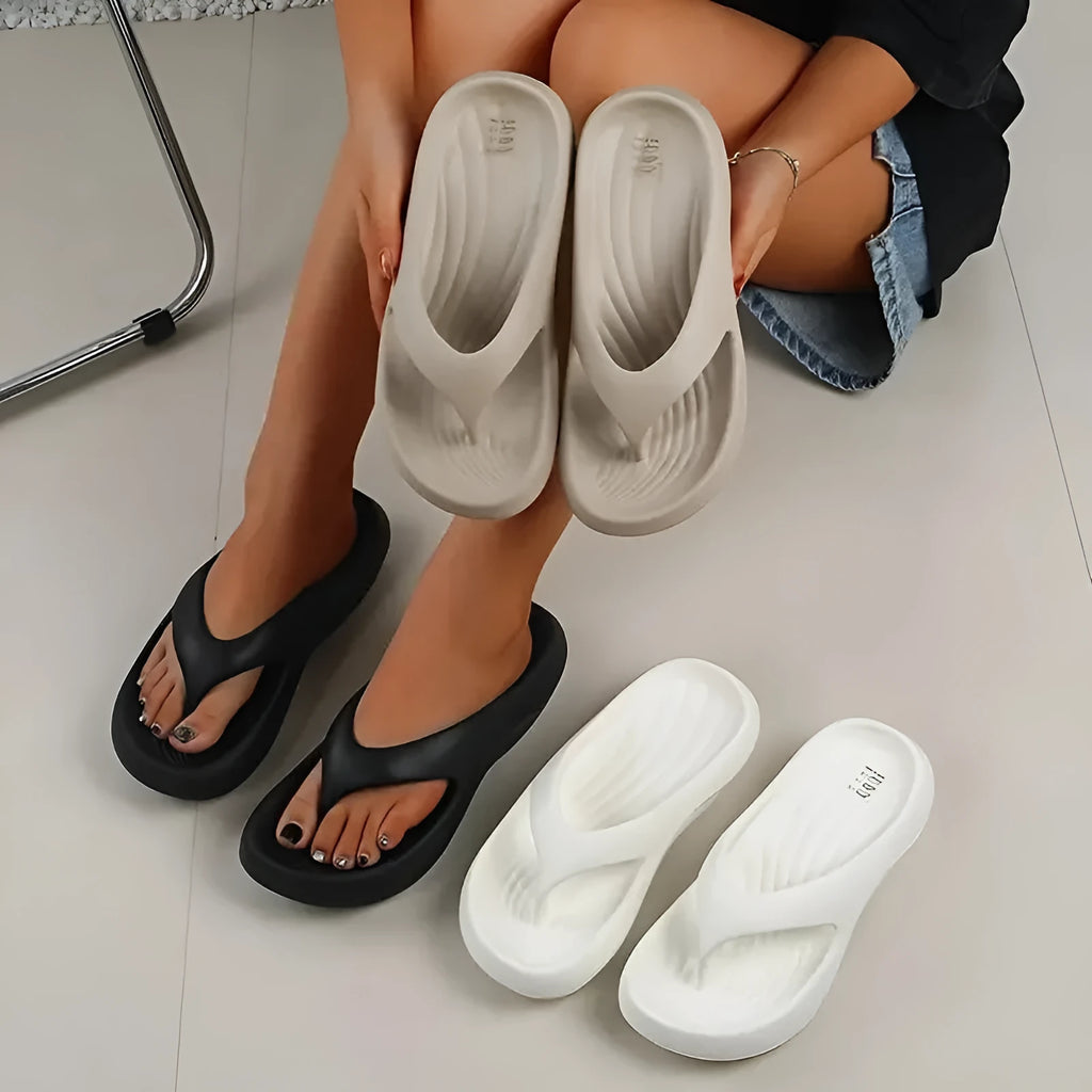 Women's thick-soled EVA flip-flops in black, white, or grey colours with non-slip sole design