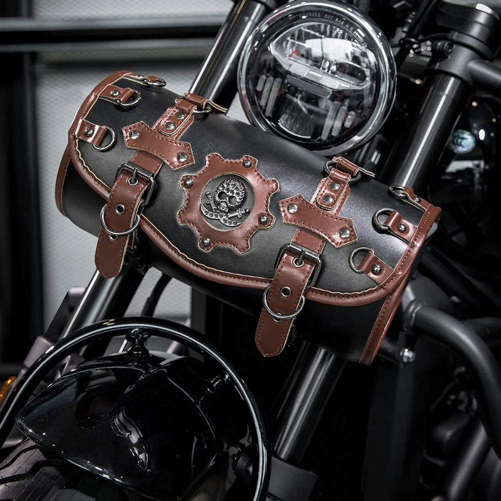 Black PU motorcycle pannier saddlebag mounted on the side of a retro-style bike.