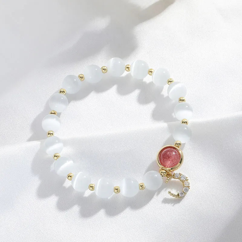 Close-up of electroplated opal cat's eye beaded bracelet for women with diamond-shaped charm