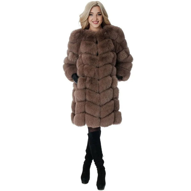 Women's long black artificial fur coat with regular sleeves, shown on a hanger.