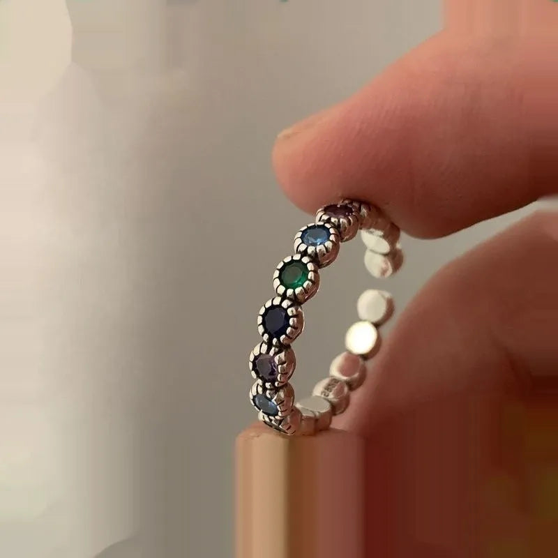 Adjustable opening women's ring with geometric round shape and zircon detailing in retro silver finish