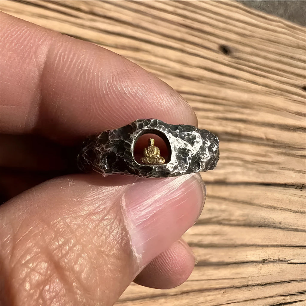 Hand-forged copper Grotto Buddha ring with rock texture design on a band